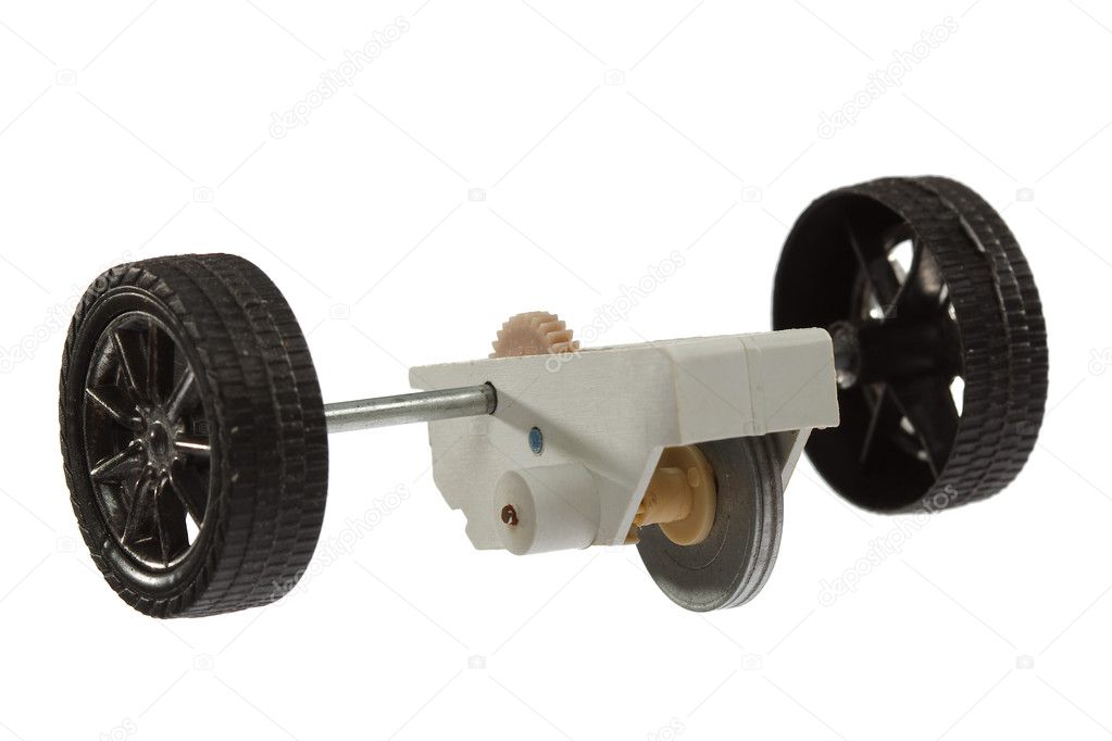 Motor and wheel of the toy car, isolated on white background