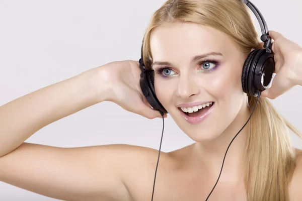 Beautiful girl is listen to the music Stock Photo