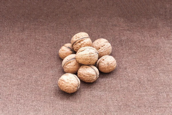 Walnuts close up on the burlap background — Stock Photo, Image