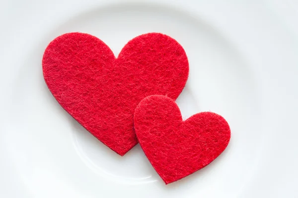 Red hearts on a plate close-up. Valentine's Day — Stock Photo, Image