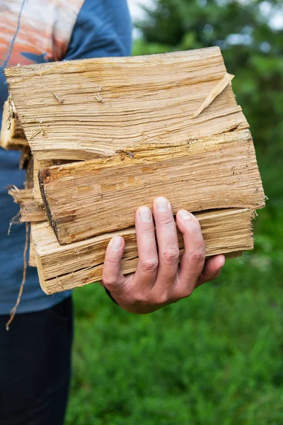 Man Hands Hold Firewood Unrecognizable Man Carries Firewood House Light — Stockfoto