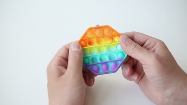 Hands Playing Rainbow Pop Toy Plaything Having Fun Sensory Stress — 图库视频影像