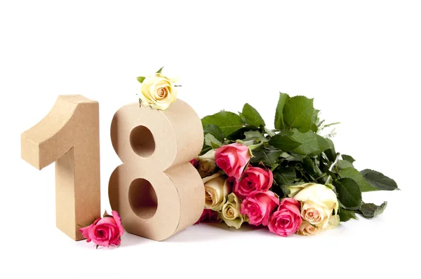 Age in figures on a bed of roses — Stock Photo, Image