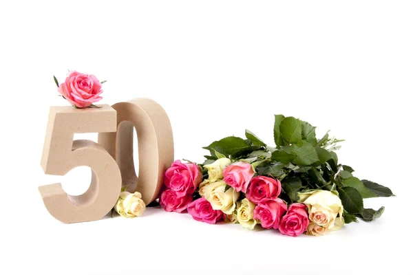 Age in figures on a bed of roses — Stock Photo, Image