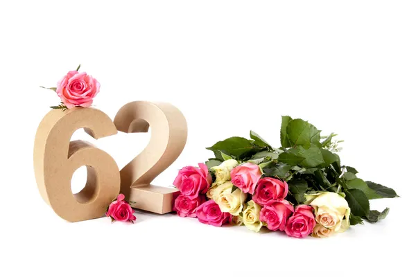 Age in figures on a bed of roses — Stock Photo, Image