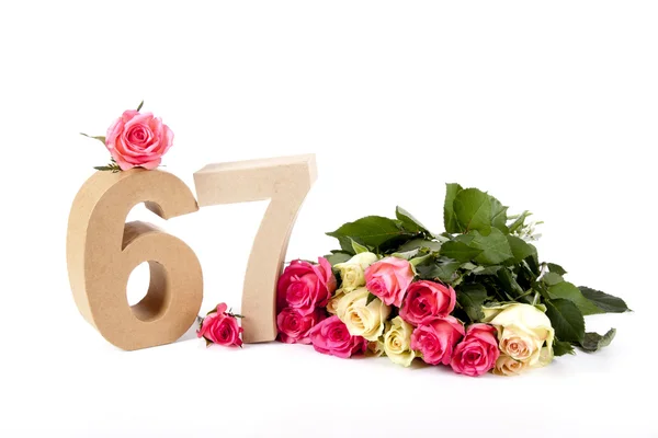 Ηλικία σε αριθμούς σε ένα κρεβάτι των τριαντάφυλλων — Φωτογραφία Αρχείου