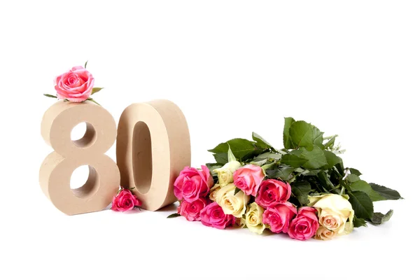 Leeftijd in cijfers op een bed van rozen — Stockfoto