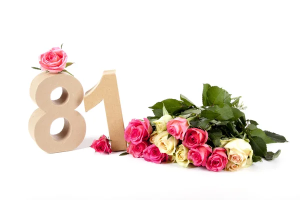 Age in figures on a bed of roses — Stock Photo, Image