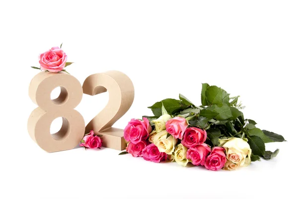 Kor a számok egy ágy a rózsák — Stock Fotó