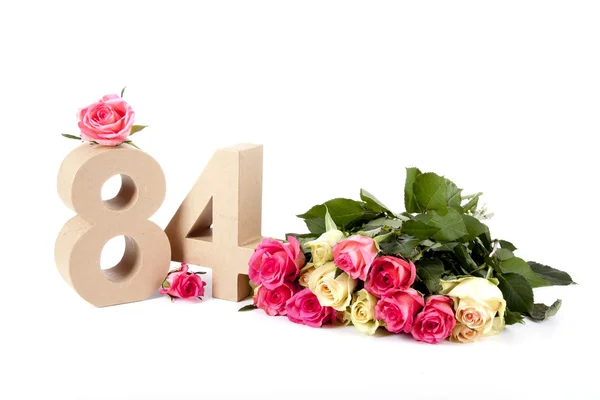 Age in figures on a bed of roses — Stock Photo, Image