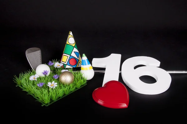 A golf club and golf ball on an artificial peace of grass to be used as a birthday card — Stock Photo, Image