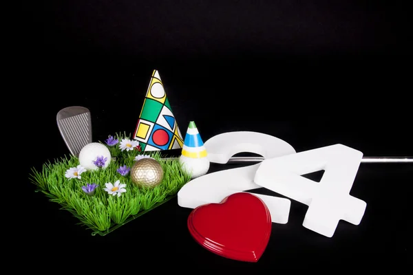 A golf club and golf ball on an artificial peace of grass to be used as a birthday card — Stock Photo, Image