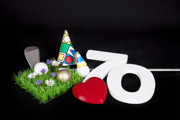 Einen Golfschläger und einen Golfball auf einem Kunstrasen, der als Geburtstagskarte verwendet werden kann — Stockfoto