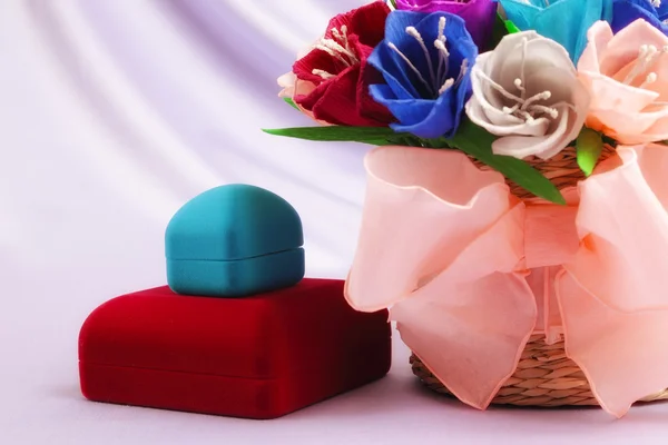 Flowers and velvet boxes — Stock Photo, Image