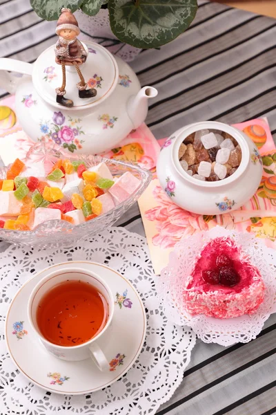 Warm cup of tea and sweets — Stock Photo, Image