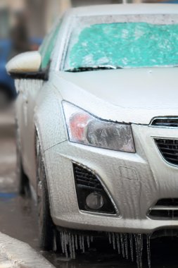 Car side covered with ice clipart