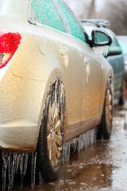 Car side covered with ice, close up clipart