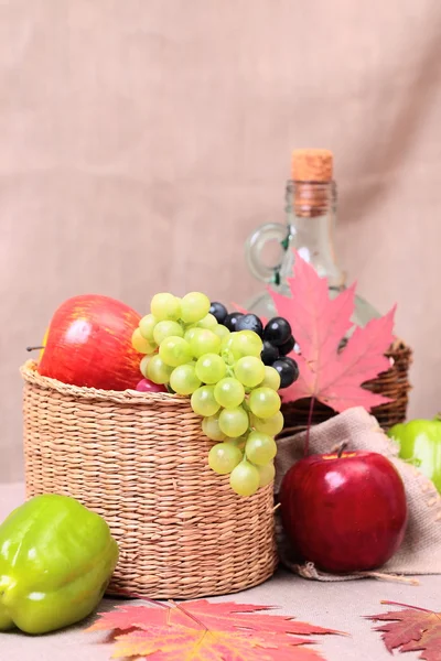 Fruits, wine and autumn leaves — Stock Photo, Image