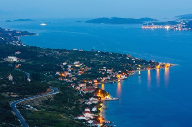 Night summer coastline and village on seashore (Peljesac peni