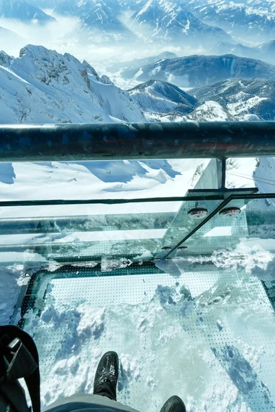 Winter Dachstein mountain massif through the glass floor. — Stock Photo, Image