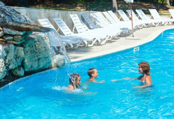 Family in the swimming pool. — Stock Photo, Image