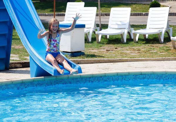 Girl in summer outdoor pool.
