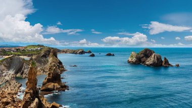 Beautiful Atlantic Ocean coastline landscape near Arnia Beach (Biskaya, Cantabria, Spain). Two shots stitch panorama.