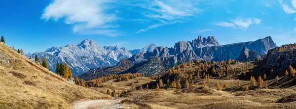 Sunny picturesque autumn alpine Dolomites rocky mountain view from hiking path from Giau Pass to Cinque Torri (Five pillars or towers) rock famous formation, Sudtirol, Italy.