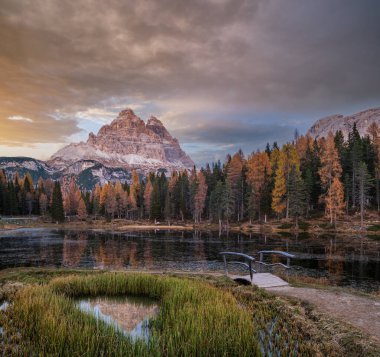 Beautiful autumn evening Lake Antorno and Three Peaks of Lavaredo (Lago Di Antorno and Tre Cime di Lavaredo), Dolomites, Italy. Picturesque traveling, seasonal and nature beauty concept scene.