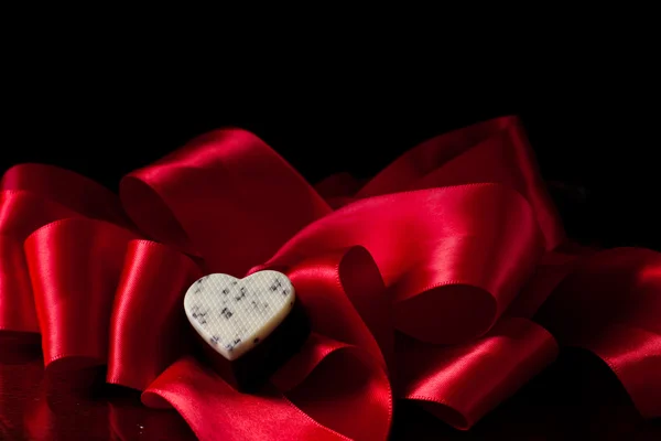 Heart shaped dark chocolate with cream — Stock Photo, Image