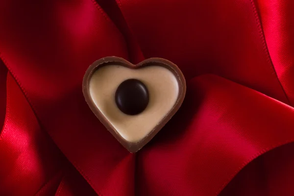 Milk chocolate with caramel cream in a heart shape — Stock Photo, Image