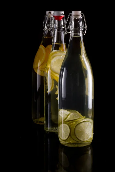 Citrus infusion in bottles — Stock Photo, Image