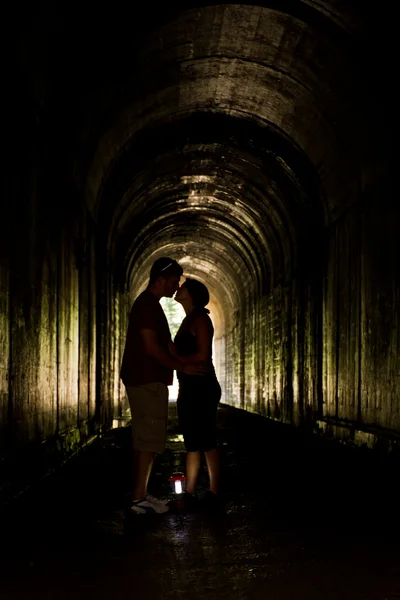 Young couple in a tunnel — Stock Photo, Image