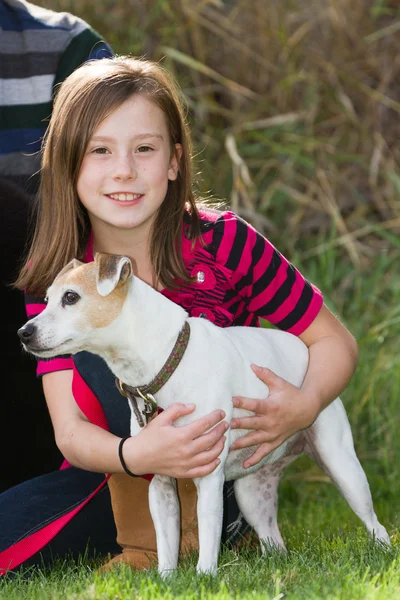 Young girl and her dog — Stock Photo, Image