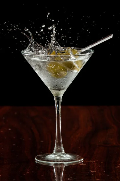 Splashing martini olives — Stock Photo, Image