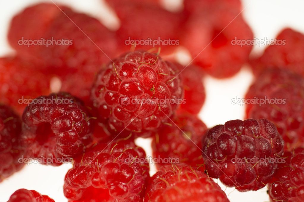 Raspberries isolated on white background, close-up