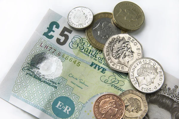 Fiver and coins — Stock Photo, Image