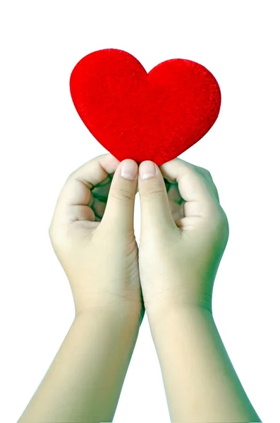 Corazón rojo en las manos sobre fondo blanco, camino de recorte — Foto de Stock