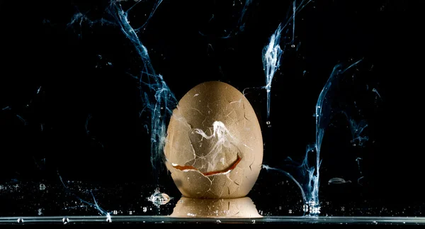 Egg splashing . over black — Stock Photo, Image