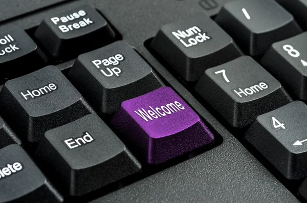 Keyboard with the word  welcome  written on a button — Stock Photo, Image