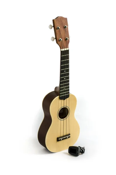 Ukulele e Tuner isolado no caminho Clipping branco incluído — Fotografia de Stock