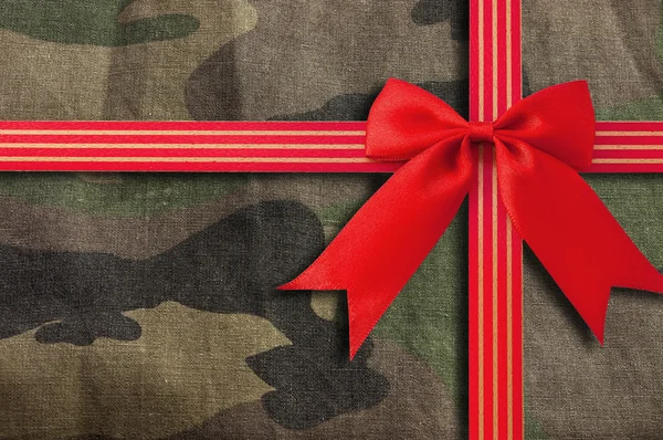 Camouflage-military texture with Red Bow — Stock Photo, Image