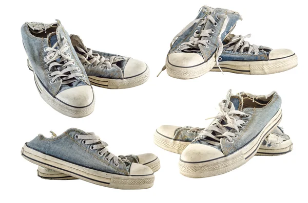 Koleksiyon eski kirli beyaz zemin üzerine spor ayakkabı — Stok fotoğraf