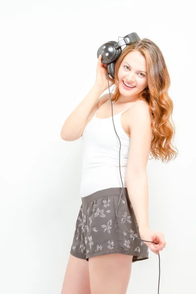 Female having fun listening to headphones — Stock Photo, Image