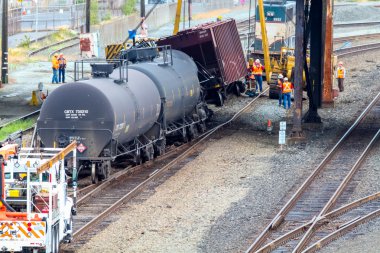 Train Cars Carrying Oil Derailed clipart