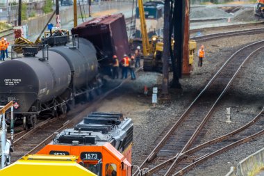 Train Cars Carrying Oil Derailed clipart