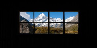 Beautiful view of Mount Cook National Park, South Island, New Zealand when see though window clipart