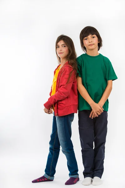 Girl and boy posing on white background — Stock Photo, Image