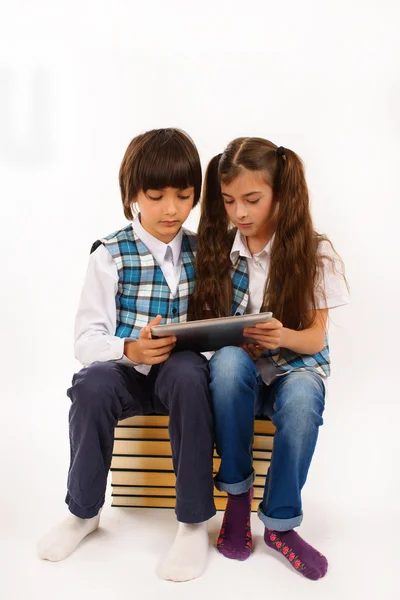 Two school children who are struggling for tablet pc — Stock Photo, Image