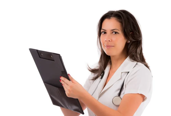 Happy smiling female doctor writing on clipboard, isolated on wh — Stock Photo, Image